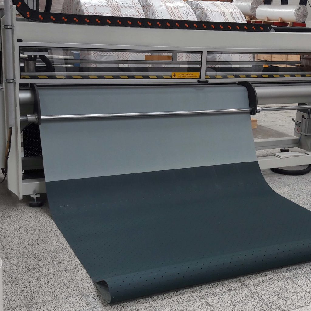Belt on the punching machine ready to be perforated. Belt on the punching machine ready to be perforated.