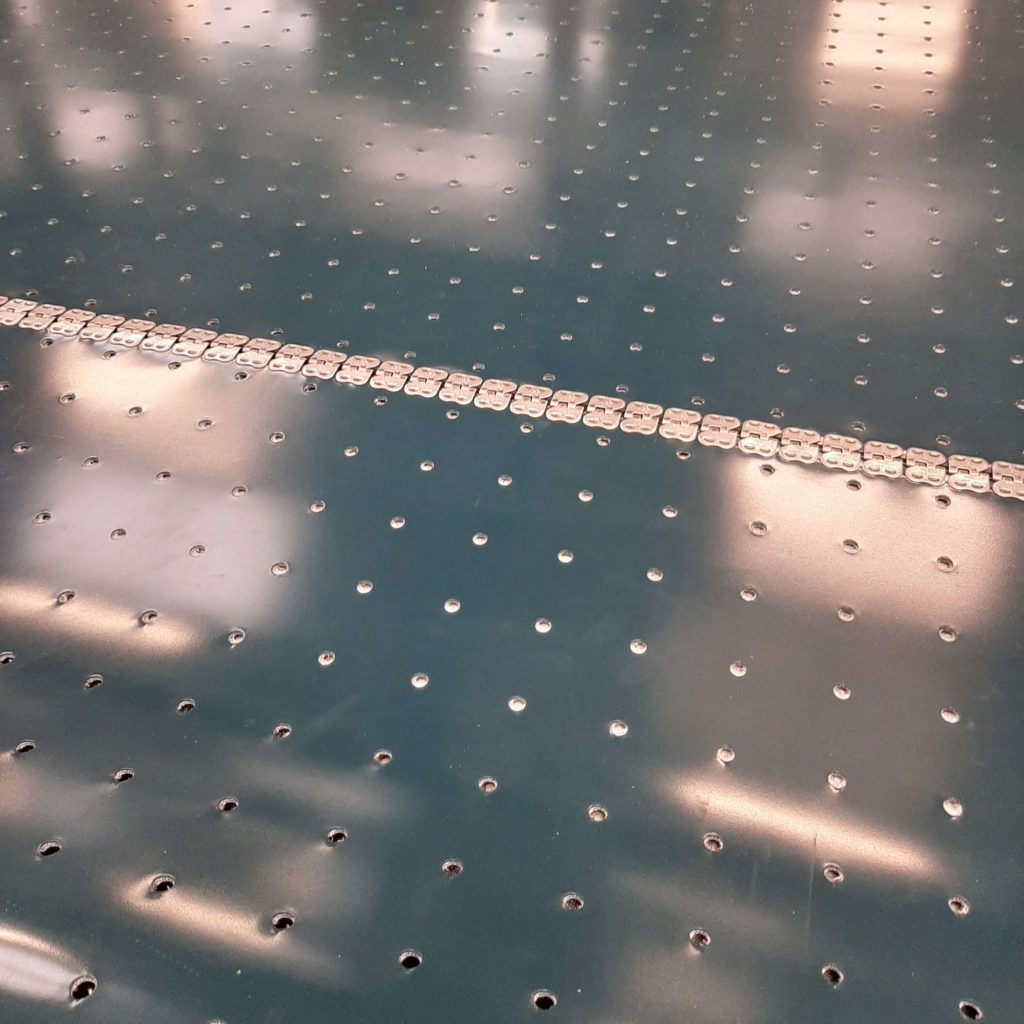 Perforated belt with metal fasteners. Perforated belt with metal fasteners.